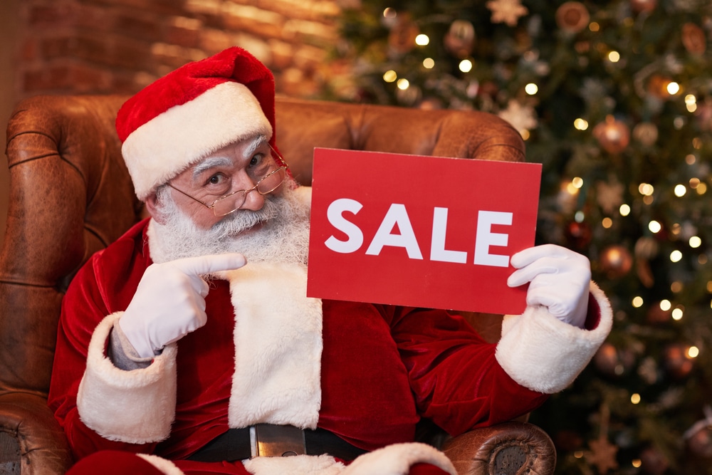 Santa holding a Sale sign