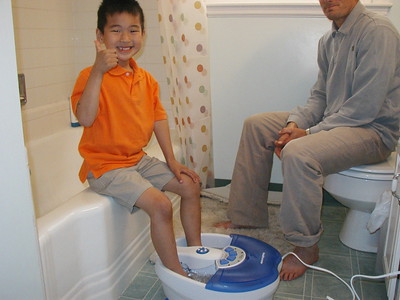 A child relaxes while getting a massage.