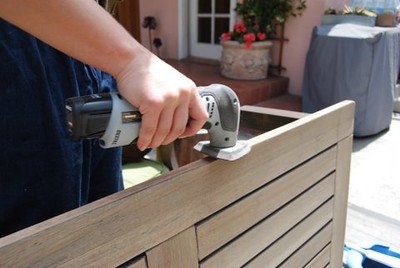 A man holding a woodworking equipment