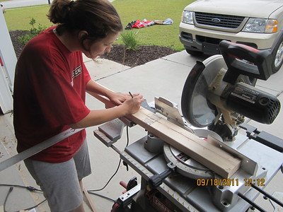 A woman using a cutting tool