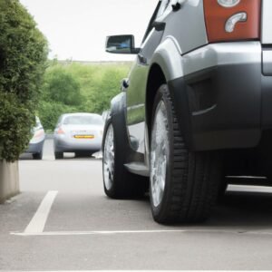 A car parked outside a shopping centre